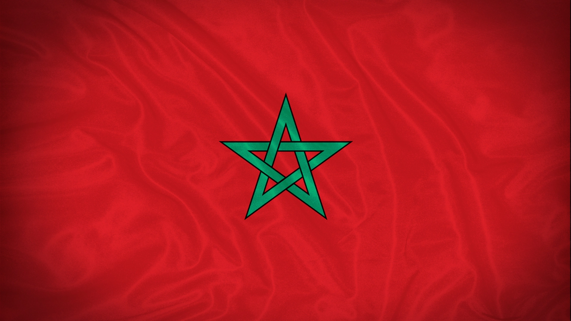 Moroccan flag with a red background and green star in the center.