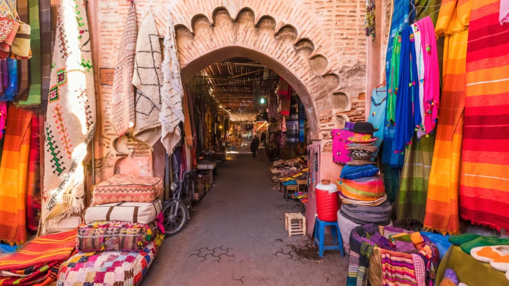 Souk El Had market in Agadir Morocco with colorful stalls and busy shoppers.